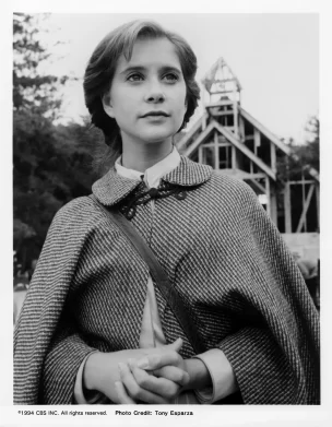 Christy in front of schoolhouse